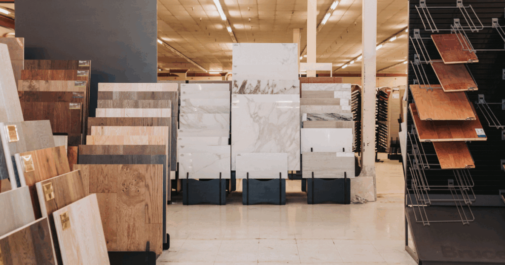 Wide-angle view of luxury vinyl plank and laminate flooring displays in Las Vegas showroom at One Stop 4 Flooring.