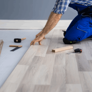 Professional flooring installer fitting luxury vinyl planks in Las Vegas home for One Stop 4 Flooring expert installation services.