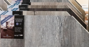 Luxury vinyl plank flooring samples in Las Vegas showroom featuring waterproof wood-look flooring options for durable, affordable home upgrades.