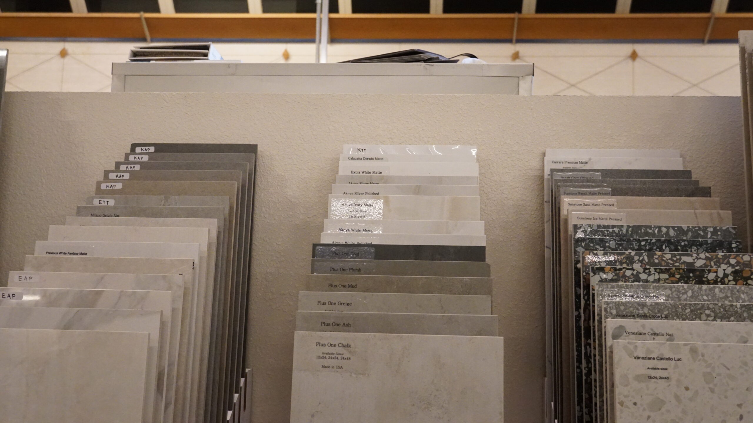 Tile flooring samples in a Las Vegas showroom featuring porcelain tile, stone flooring, and modern styles for home renovation projects.
